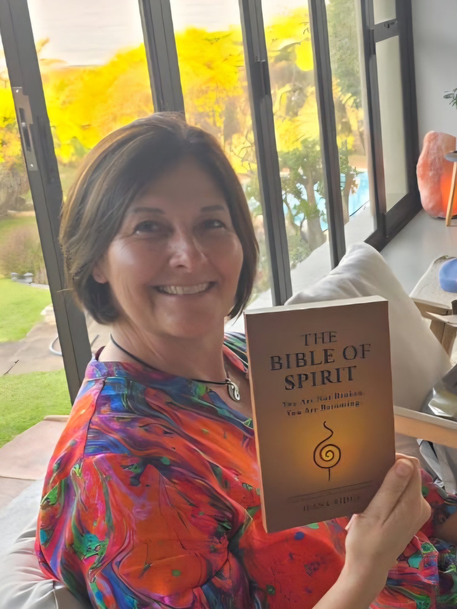 Ilana Ridge holding The Bible of Spirit